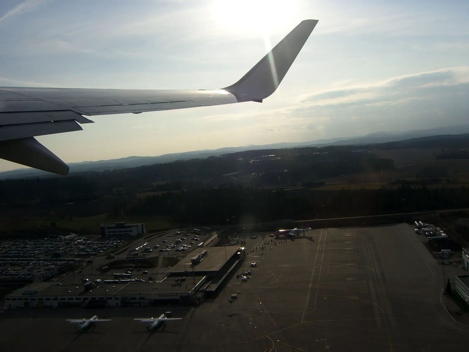 Aerial view of Sandefjord Airport, Torp. On the ground is one Wizzair A320 and two Widerøe Dash-8-300s.