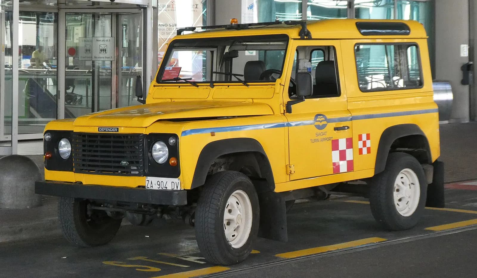 SAGAT airport vehicle parked beside Turin Airport buildings
