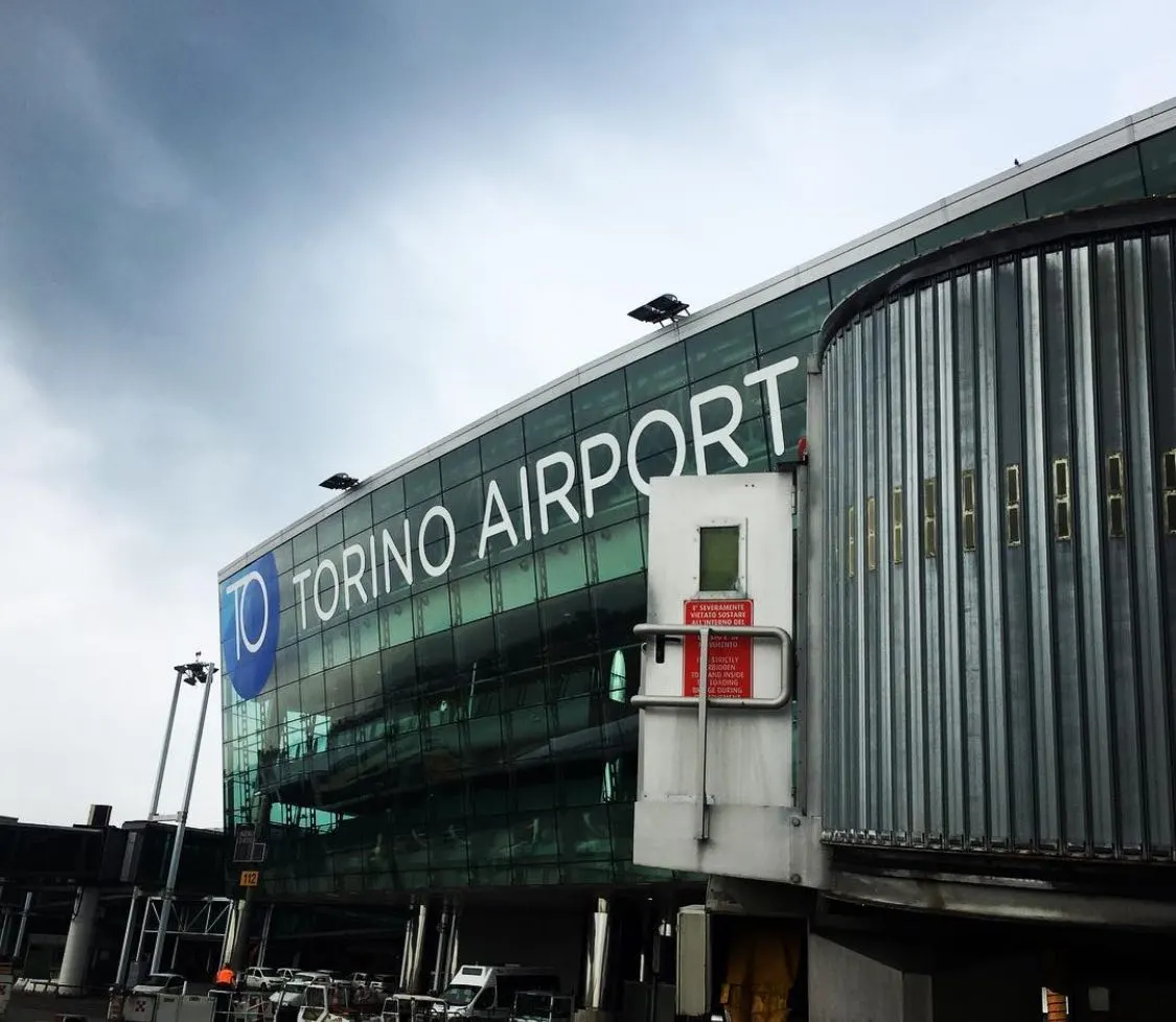 Approach view toward Turin Airport terminal and control tower