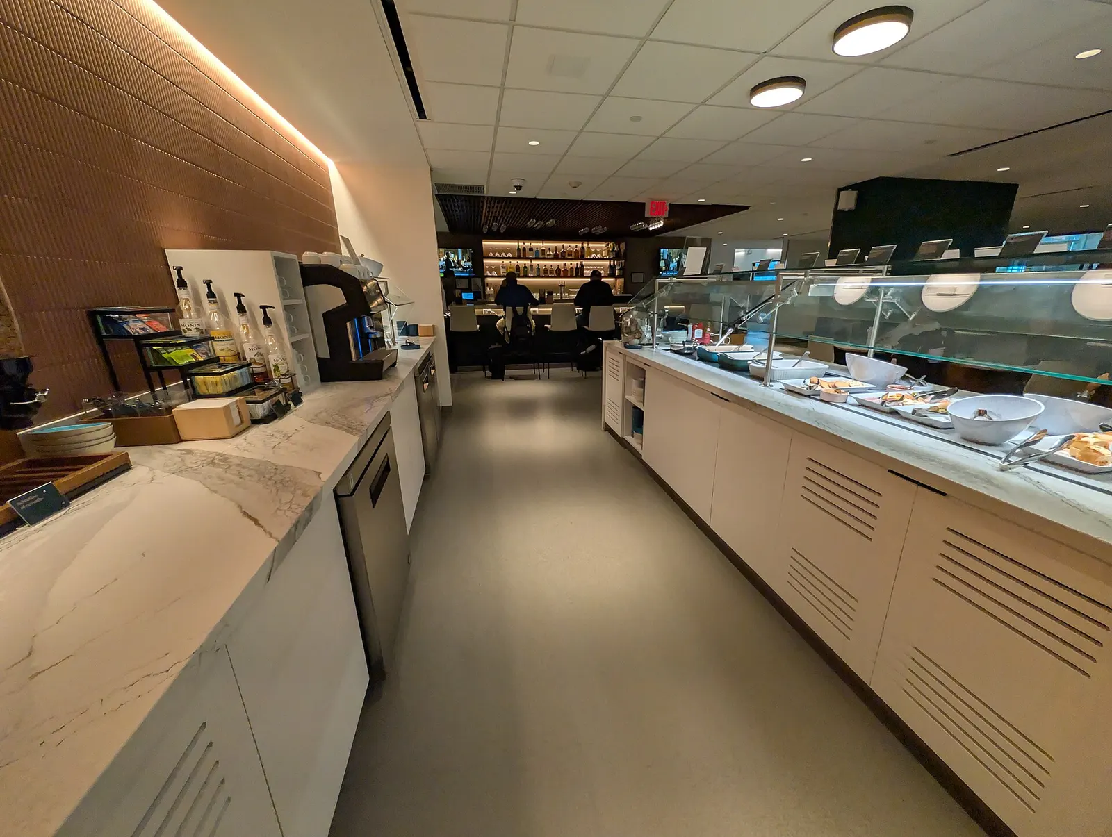 Escape Lounge drinks, buffet, and bar just inside security at Tulsa International Airport in October 2025.