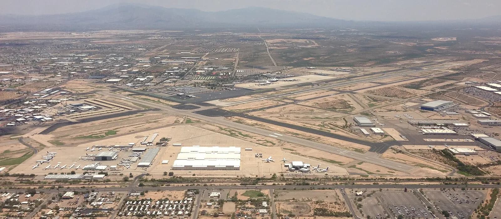 Aerial of Tucson International Airport in July 2013 showing the X-roof terminal and runways