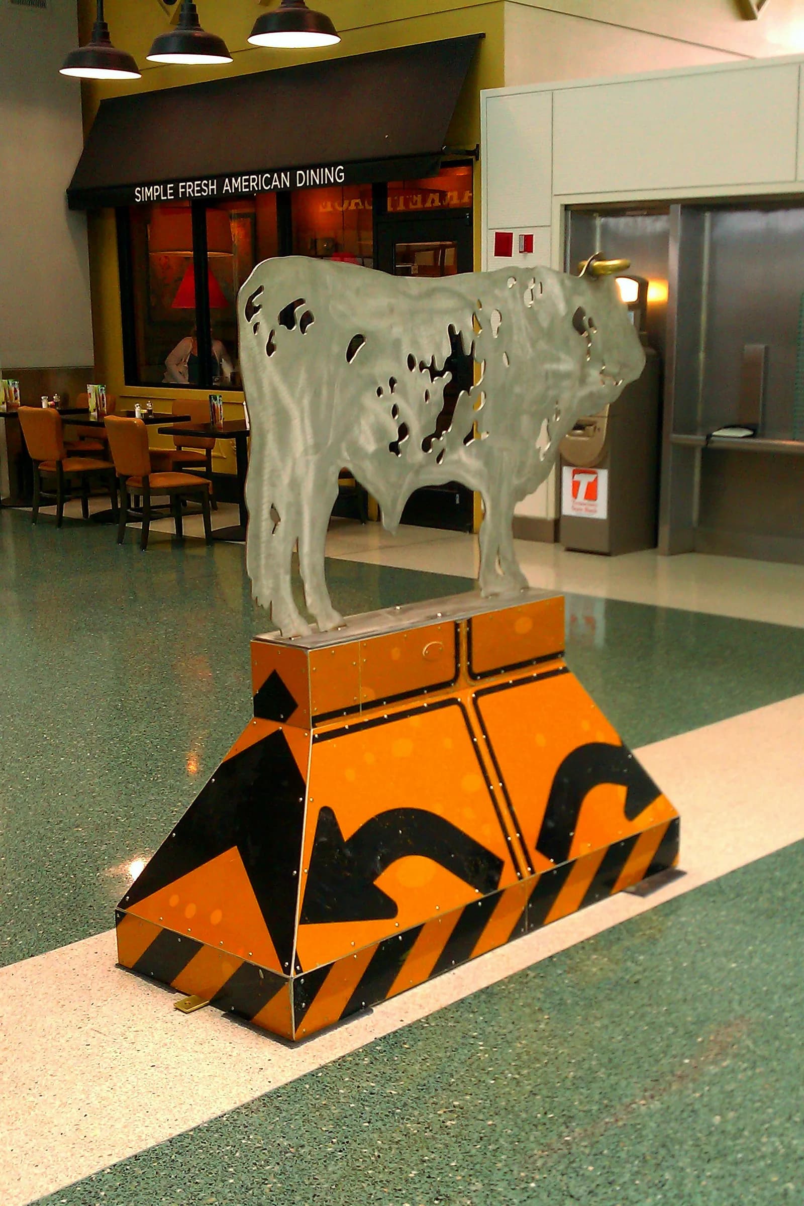 2011 metal cow sculpture with Tennessee road signs inside McGhee Tyson