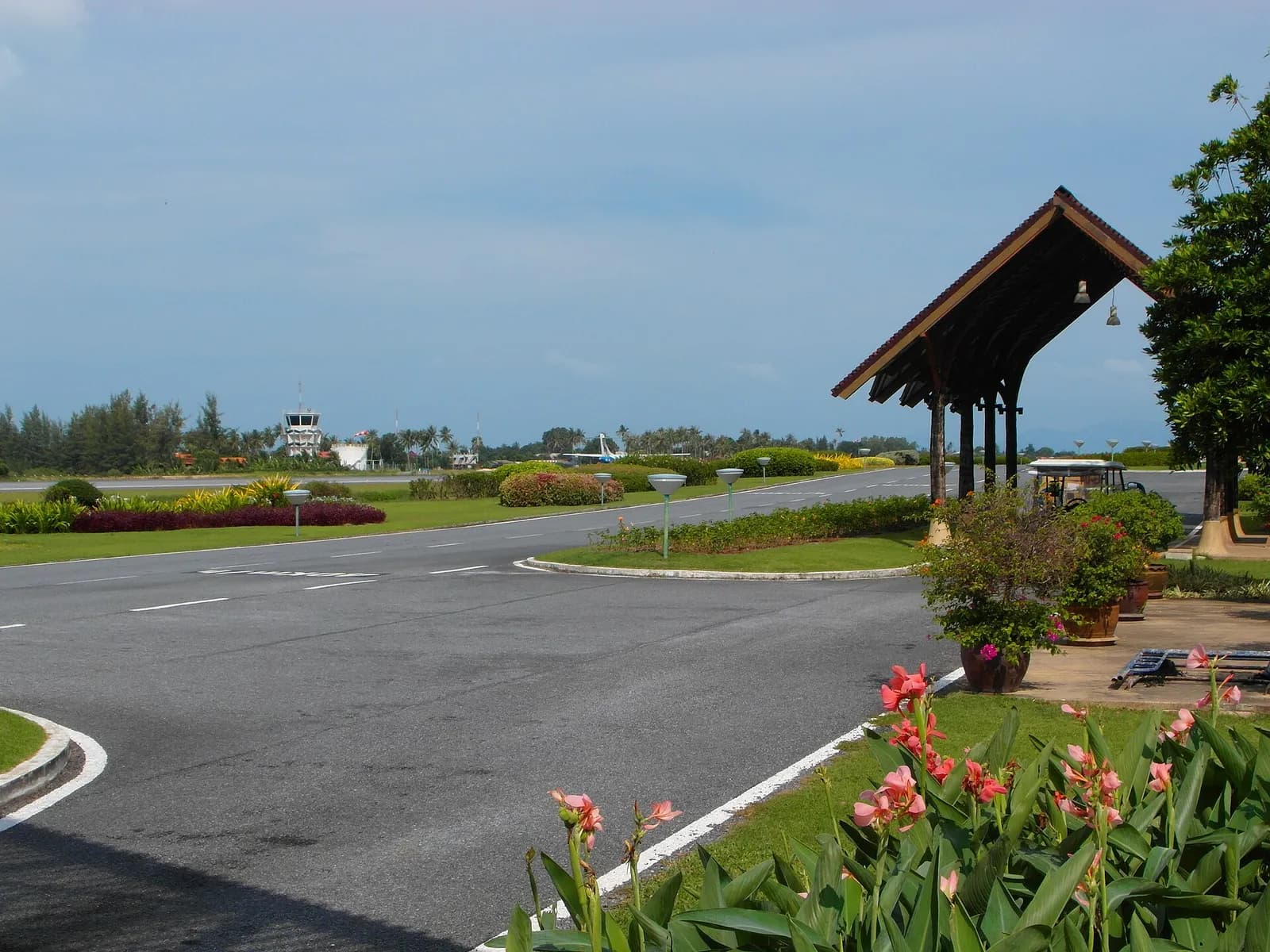 Panorama of Samui Airport terminal roofs and garden courtyards in December 2012