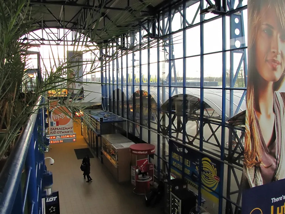Wrocław Airport passenger terminal building seen from the landside approach.
