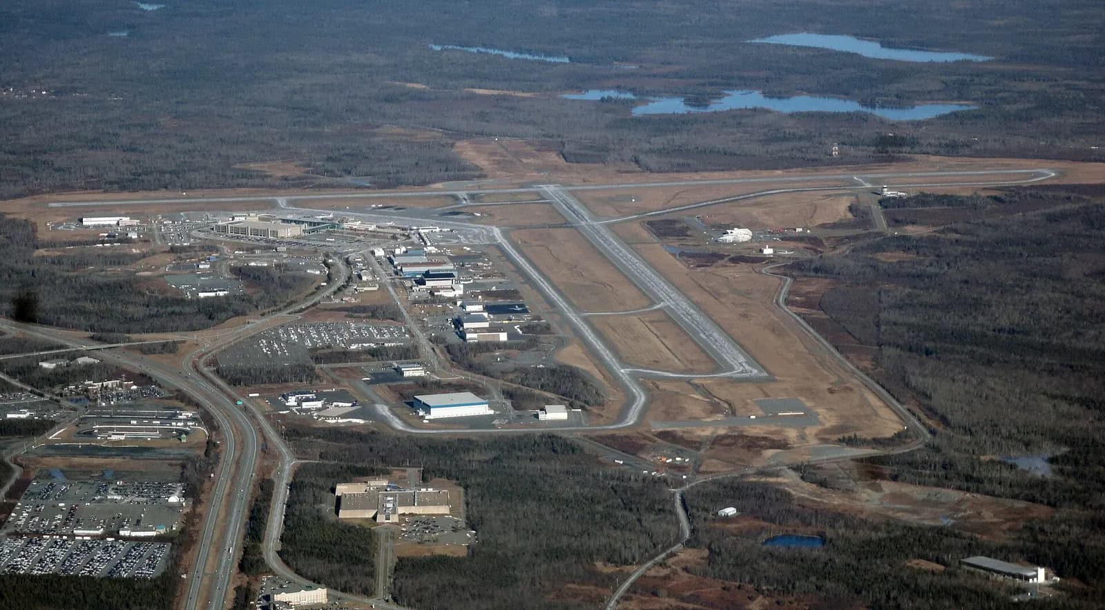 Aerial of Halifax Stanfield’s intersecting 05/23 and 14/32 runways, terminal, and Highway 102.