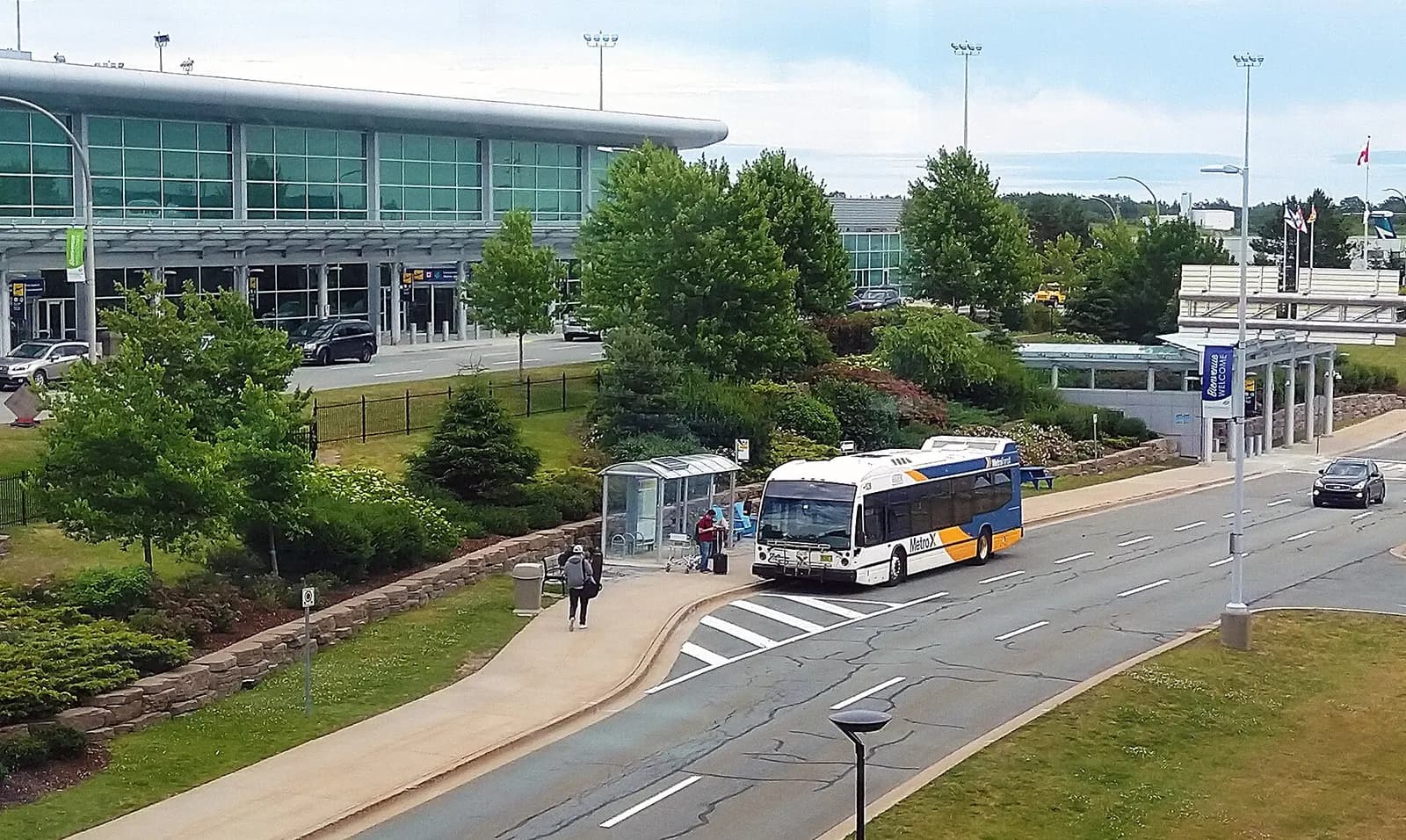A Halifax Transit MetroX 320 bus parked at the Halifax Stanfield airport curb in 2018.
