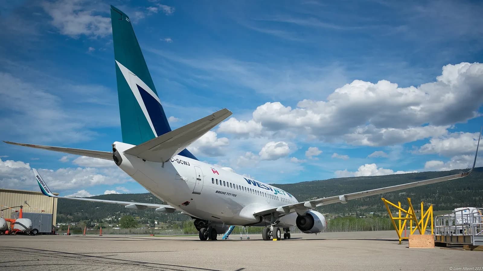 WestJet Boeing 737-700 C-GCWJ on the apron at Kelowna International Airport in 2017.