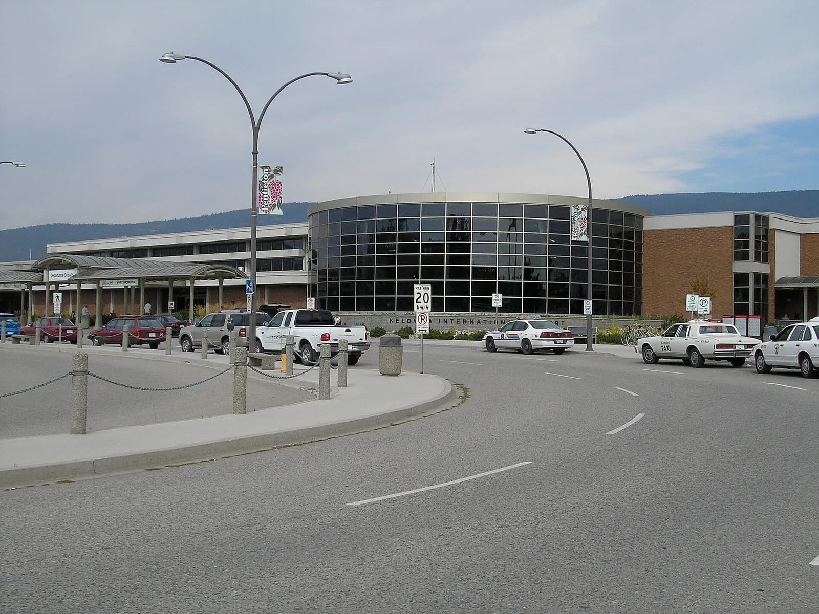 August 2006 aerial photograph of Kelowna International Airport showing the single runway and compact civil terminal.