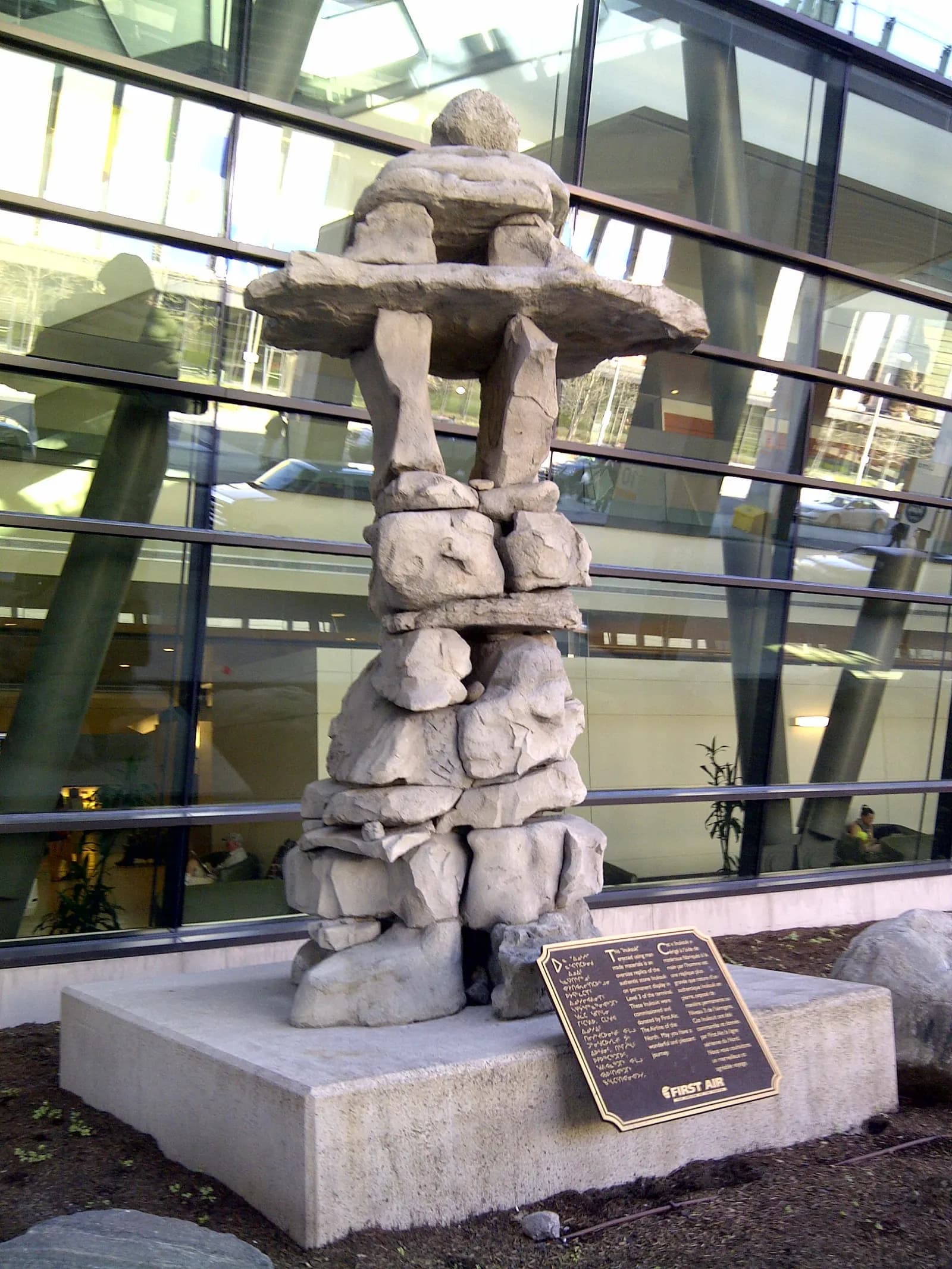 Inukshuk at Macdonald-Cartier International Airport in Ottawa, Ontario, Canada. Built on site in 2003 by Inuit Elder Peter Katorka, and Commissioner of Nunavut, Peter Irniq, using stones collected from various communities in Nunavut.