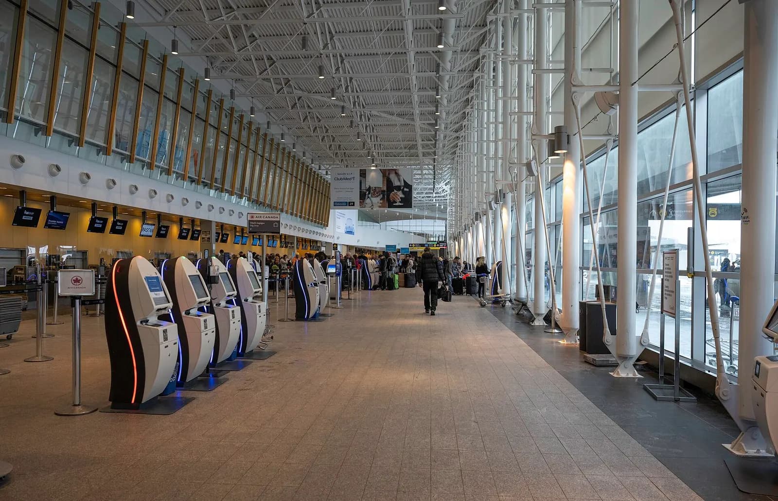 Air Canada branded self-serve check-in kiosks at YQB