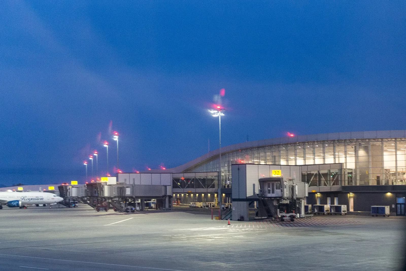 YQB airside apron and jet bridges at dusk, photographed October 2024