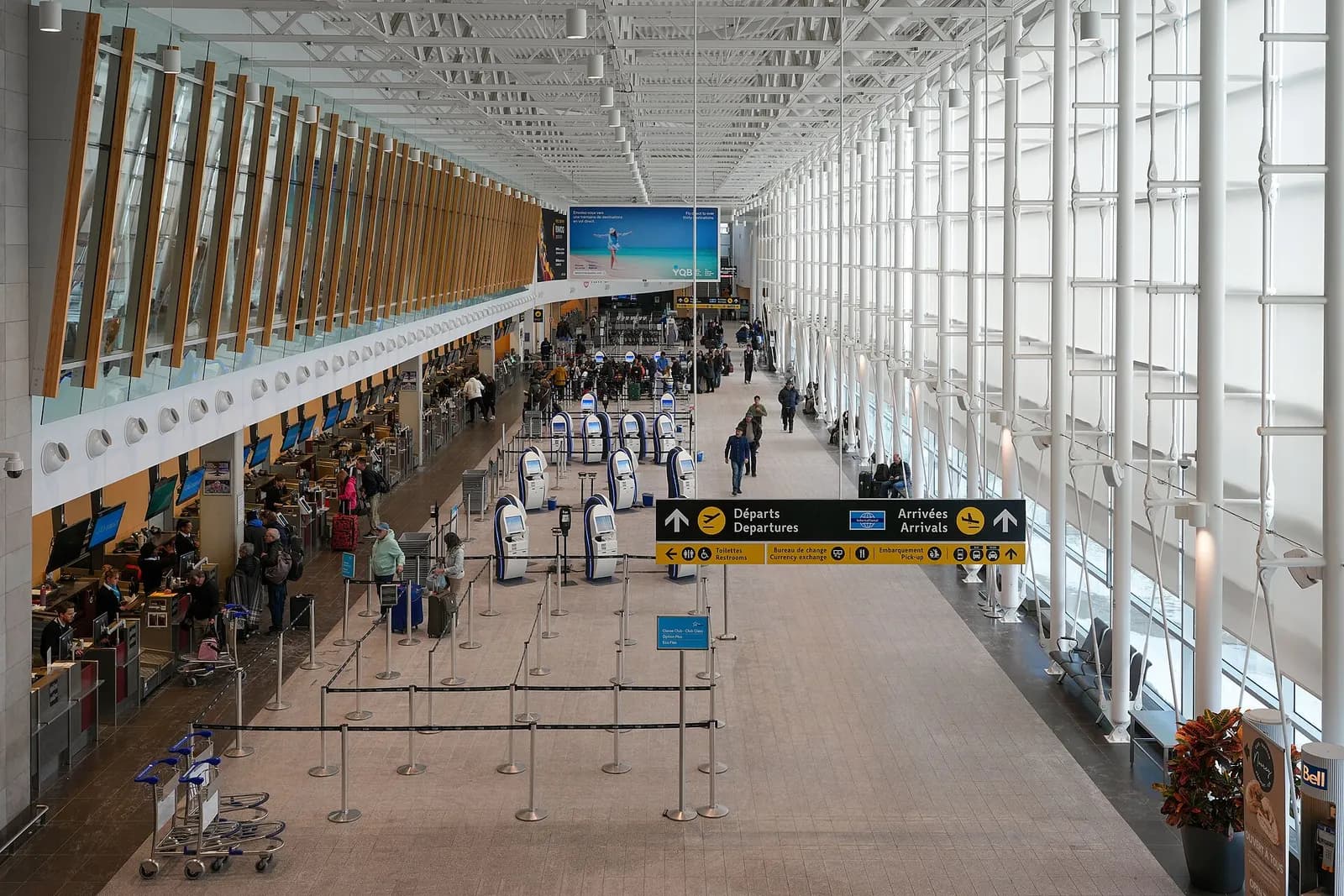 Québec City Jean Lesage International Airport main terminal check-in hall looking toward the departures mezzanine
