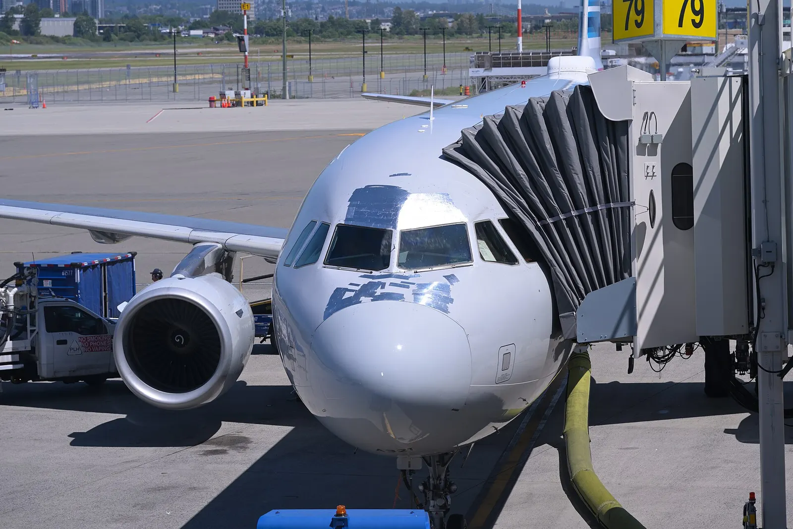 American Airlines Airbus A321 N156UW at gate E79 at Vancouver International Airport. Note the extensive amount of speed tape on the nose.