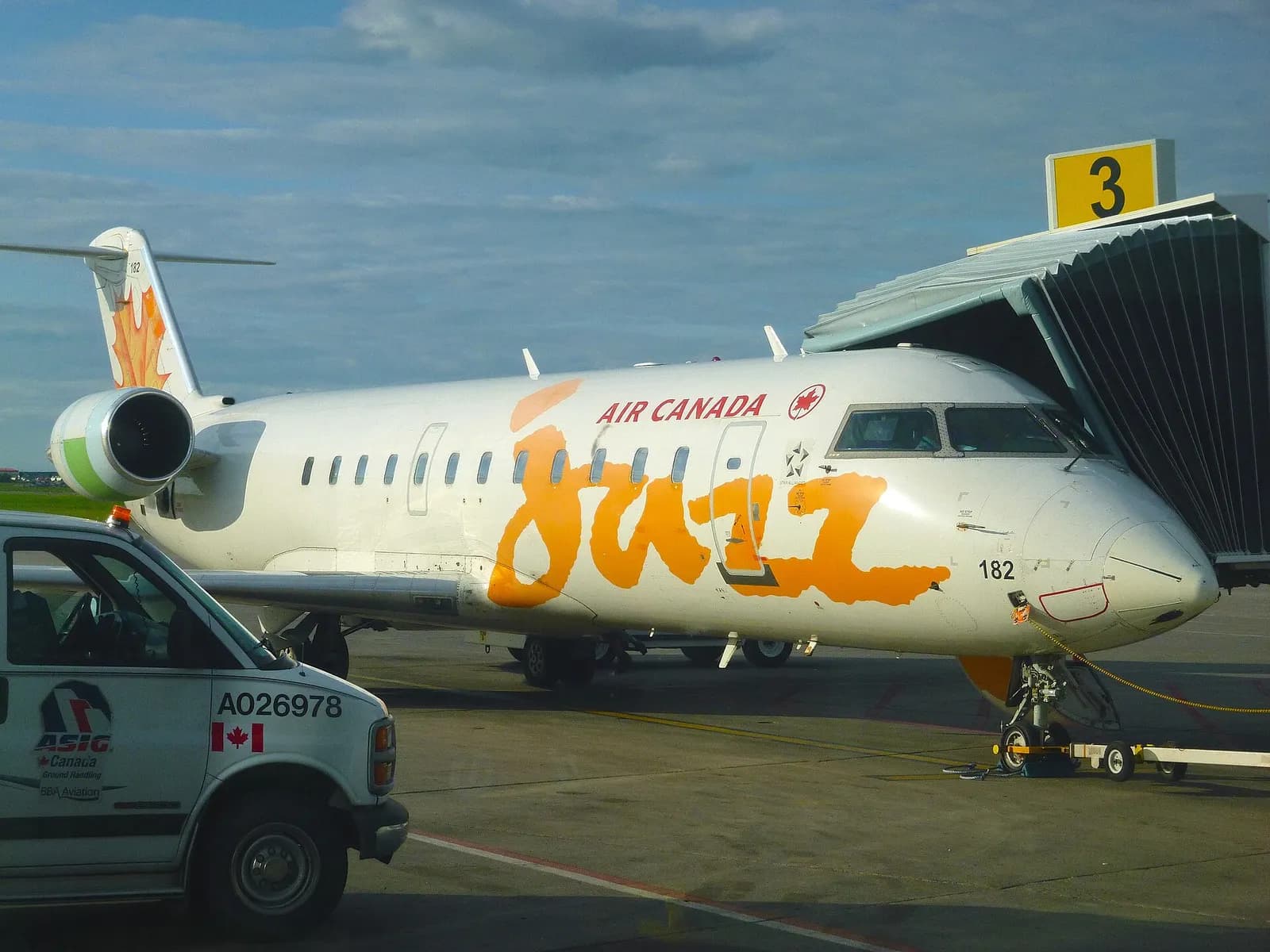 An Air Canada Jazz CRJ-200 parked at Gate 3 at Saskatoon in March 2016, with the jet bridge connected to the aircraft.