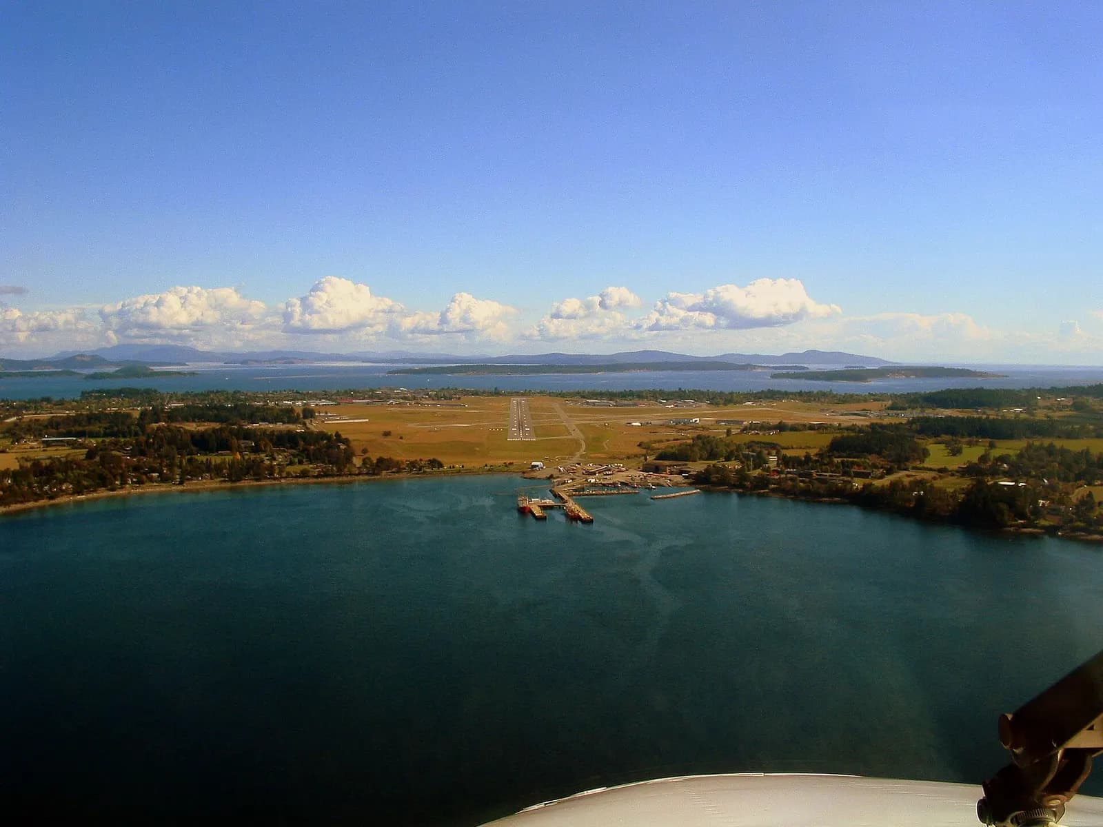 Aerial approach to runway 09 at Victoria International Airport over Patricia Bay and the Saanich Peninsula.