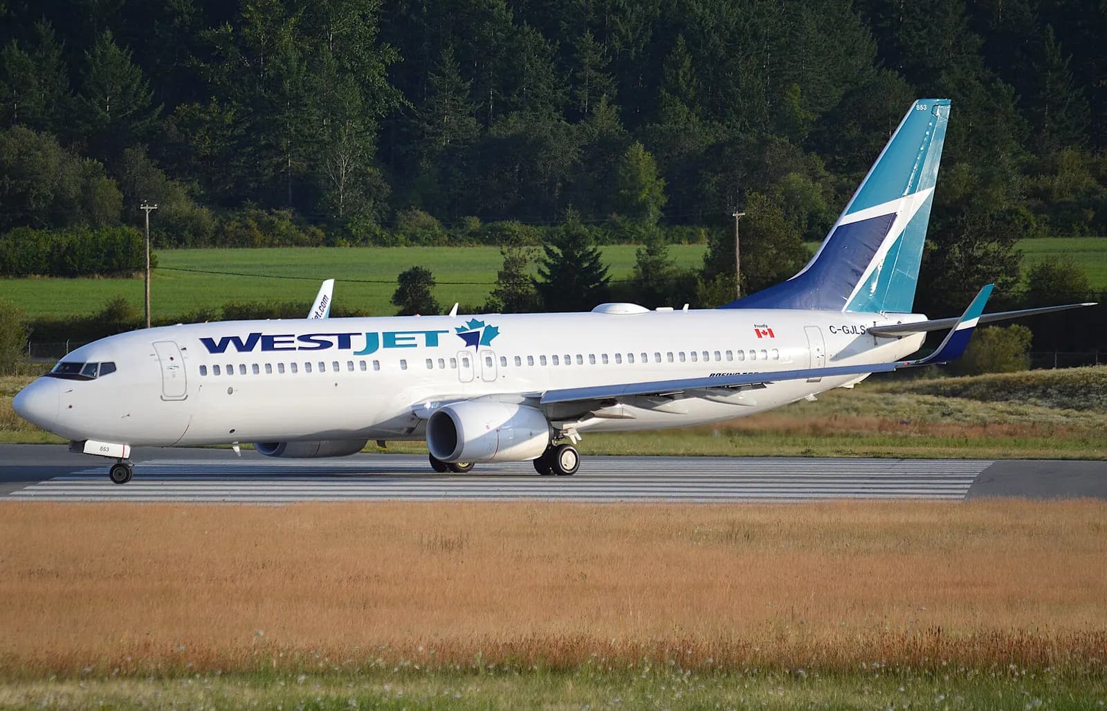 WestJet Boeing 737-800 C-GJLS on the apron at Victoria International Airport in July 2019.