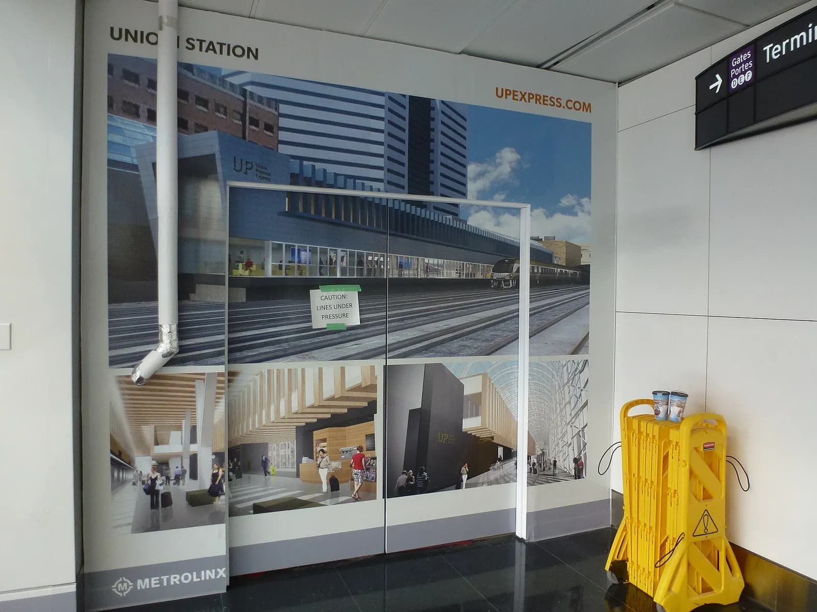 The glass-walled loading mezzanine for Pearson's inter-terminal shuttle cable car shows the platform where passengers board between terminals.