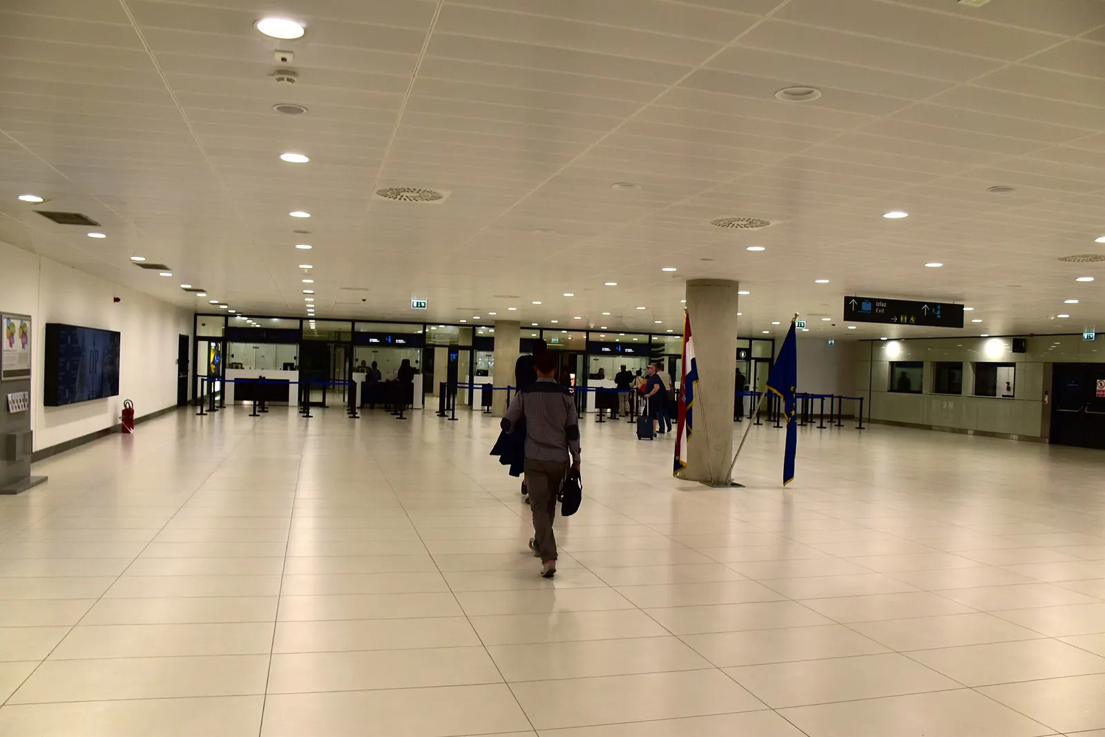 Passport control hall in arrivals area of Zagreb Franjo Tuđman Airport .